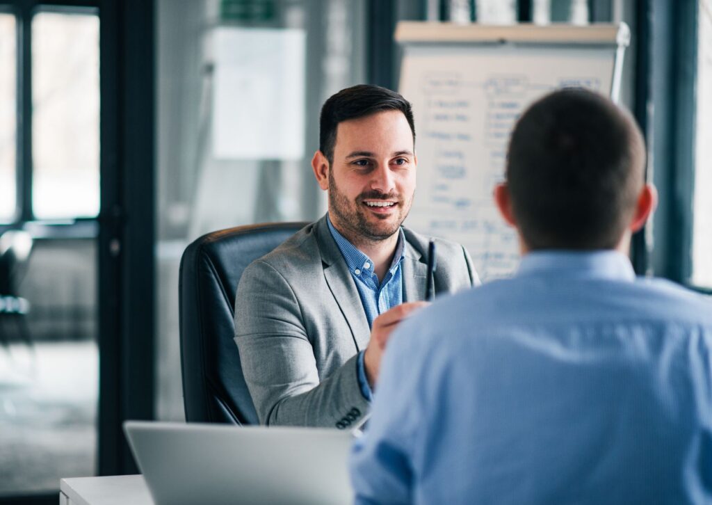 A man executive coaching another man