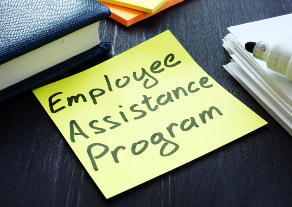 employee assistance programs written on a post it note