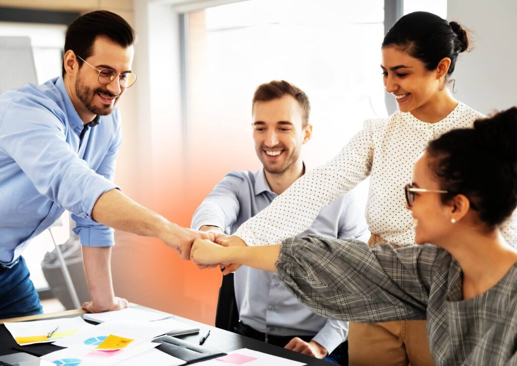 employees-fist-bumping-during-a-monthly-activity