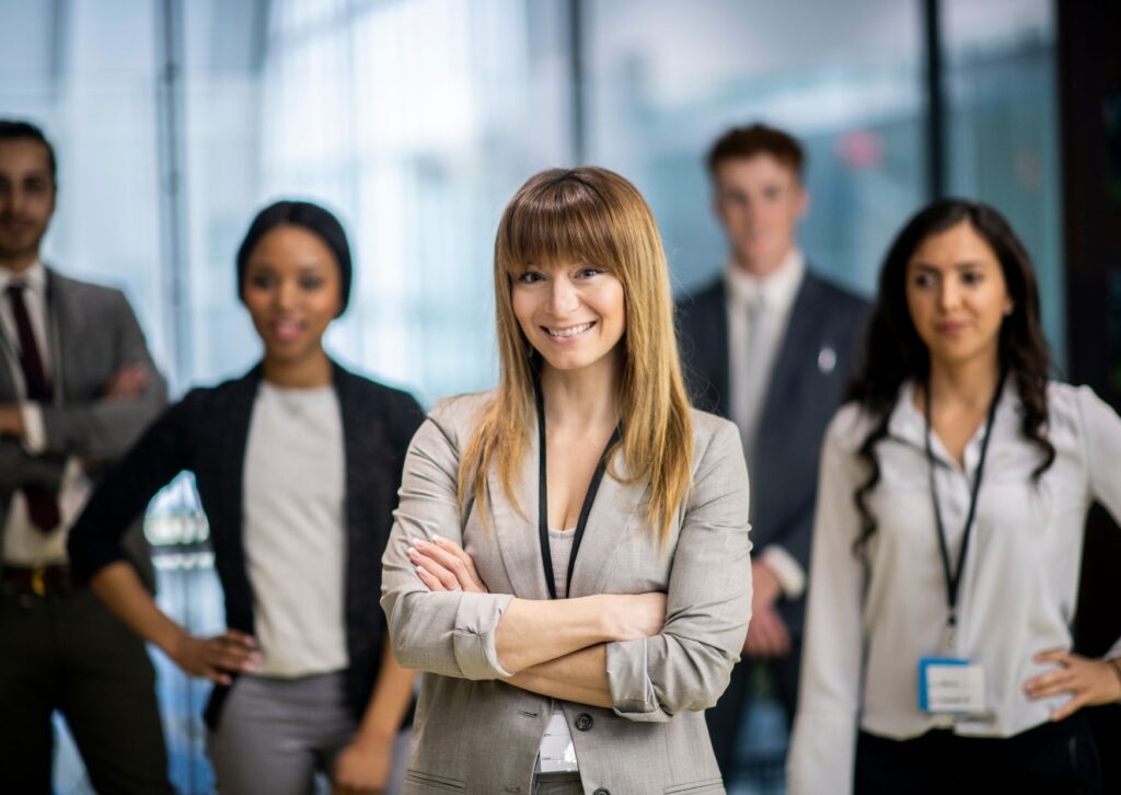 Employees standing confidently