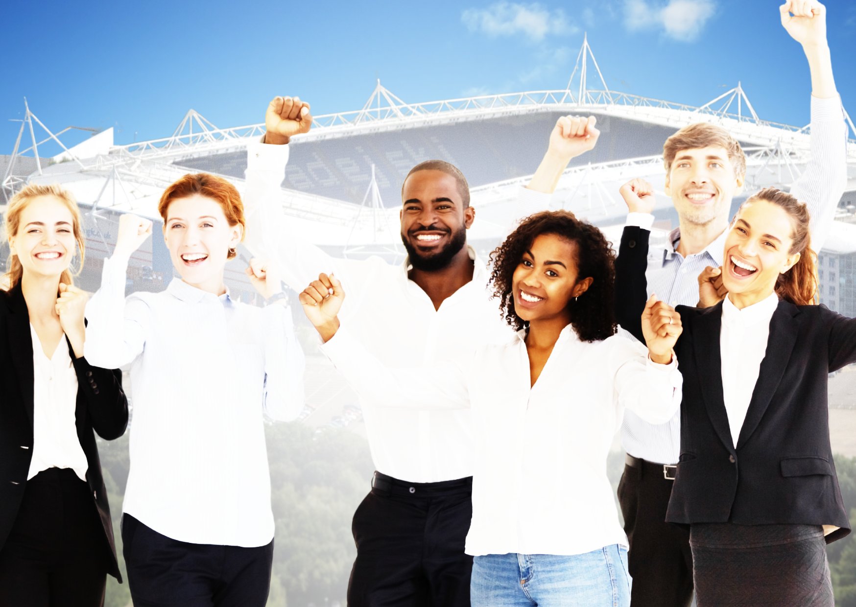 employees-with-hands-up-celebrating-at-a-team-building-day-with-the-reading-madejski stadium-in-the-background