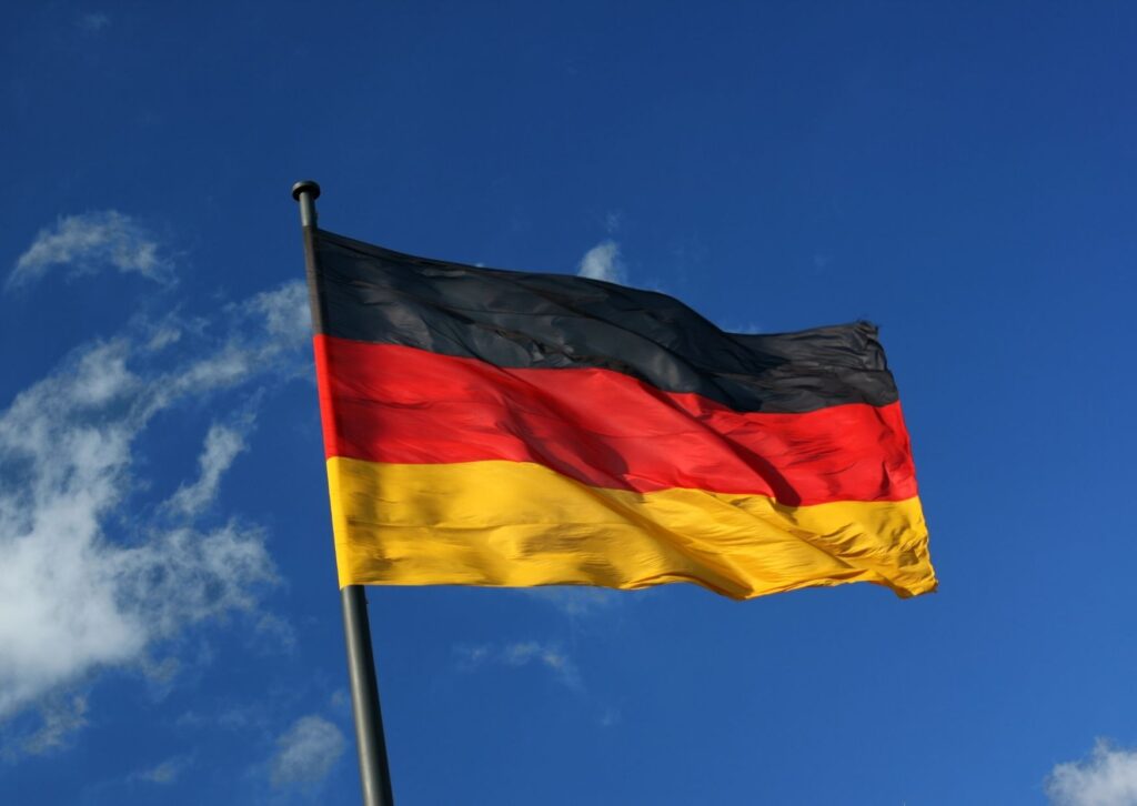 german-flag-infront-of-a-bright-blue-sky