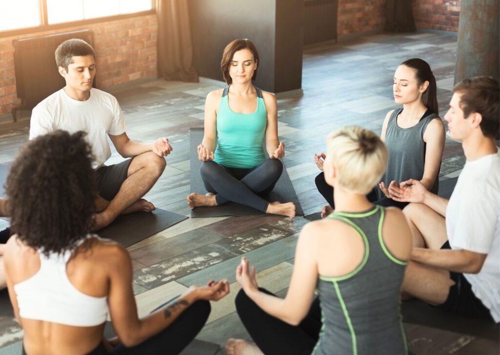 Group of people doing yoga