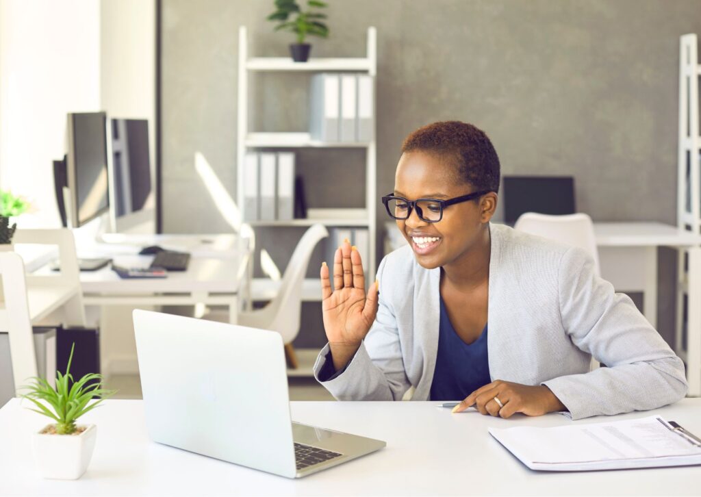 happy remote worker at her desk at home