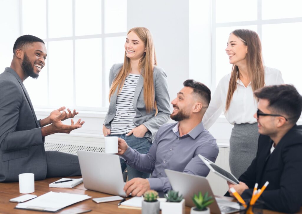 Happy staff in a team meeting