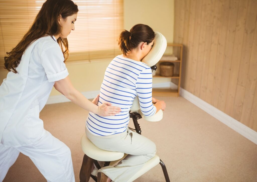 lady-getting-chair-massage-at-work-on-a-portable-massage-chair