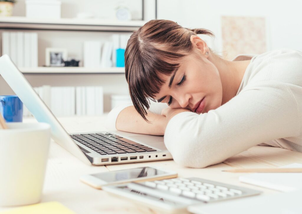 lady-having-a-power-nap-at-work