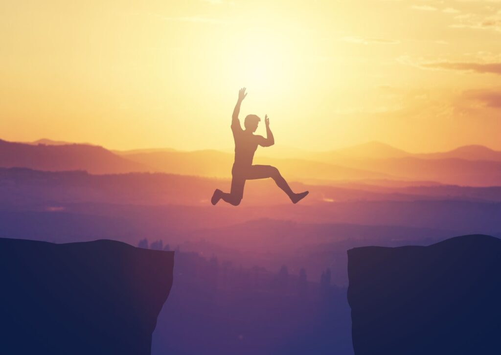 man jumping to challenge himself