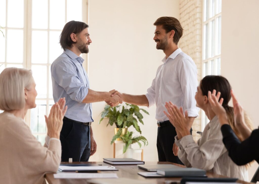 man shaking his colleagues hand