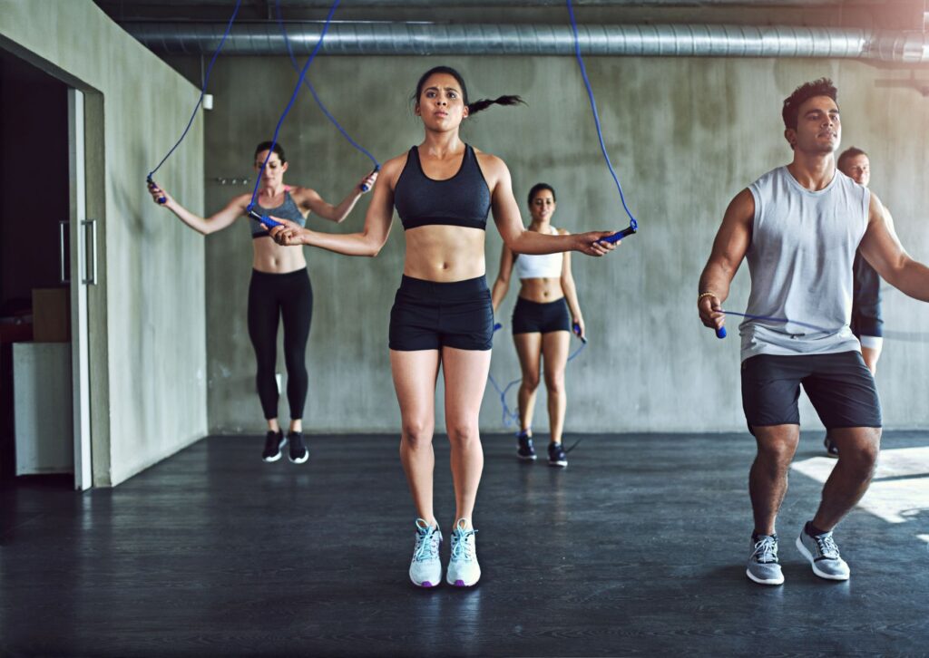 men-and-women-skipping-in-fitness-clothes