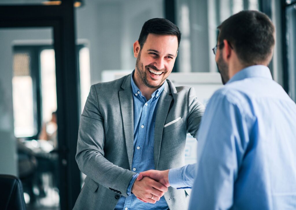 men-shaking-hands-at-a-client-meeting