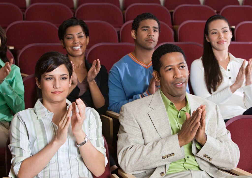 people seated at the theatre