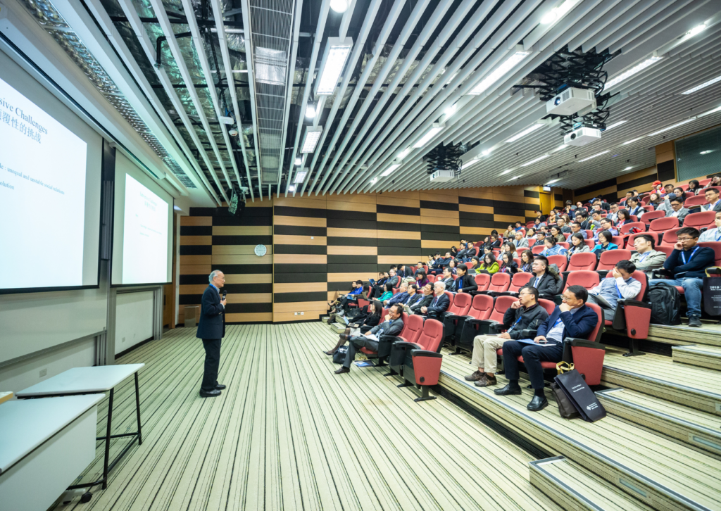 man at conference talking